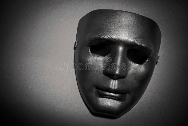 Black Mask Under a Bundle of Blue Stock Photo Image of nose, spooky