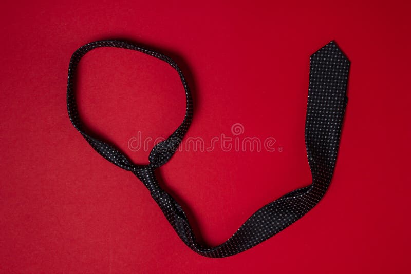 Black Men`s Tie. Tie on a Red Background. Male Style Stock Photo ...