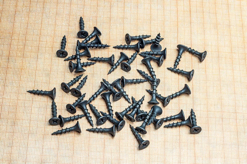 Metal Hardware with Carvings Figures on a Wooden Background Stock Image