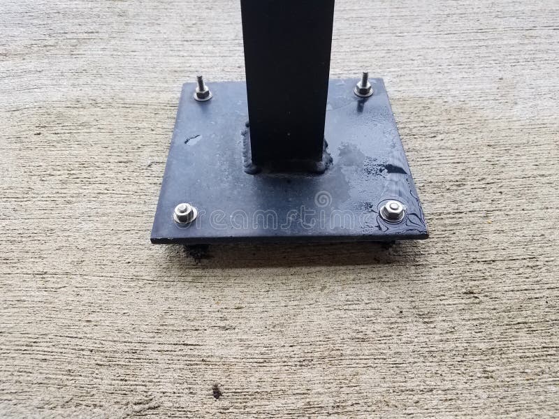 Black Metal Post with Screws on Grey Cement Stock Image Image of
