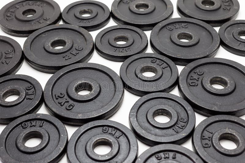 Black Metal Weights 1kg and 2kg on White Background. Stock Image