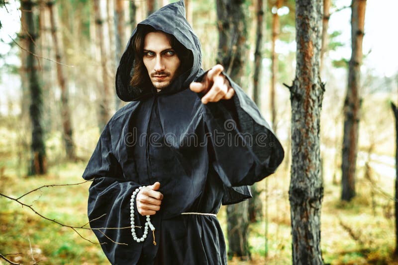 Warlock pointing finger stock photography