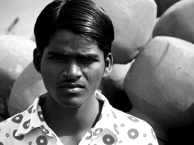 A Boy Poses for a Photo while Herding Cattle Outside of Bhadarsa