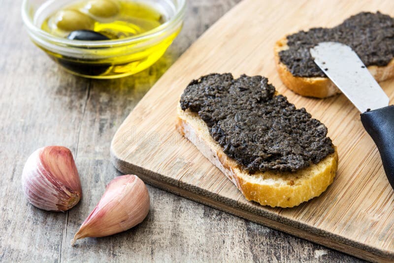 Black Olive Tapenade with Anchovies, Garlic and Olive Oil Stock Image ...