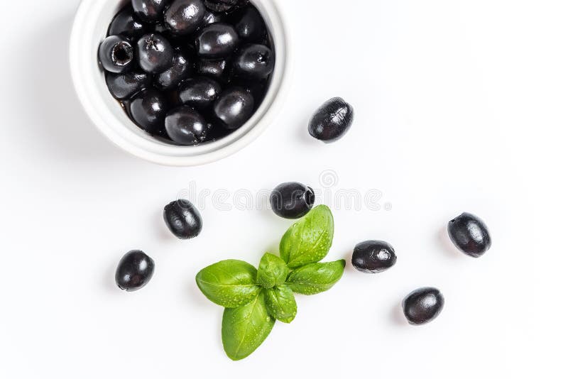 Black olives on white stock image. Image of diet, leaf 157374623