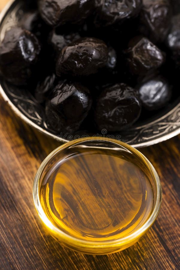 Black olives and olive oil stock photo. Image of gourmet 110833478