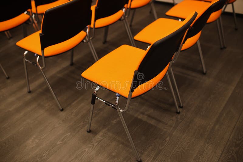 Black and Orange Chairs in the Conference Room. Black and Orange Chairs