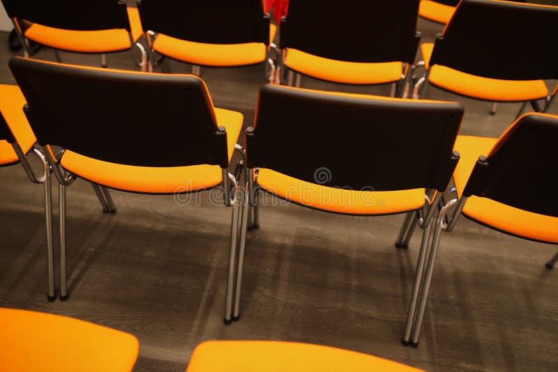 Black and Orange Chairs in the Conference Room. Black and Orange Chairs