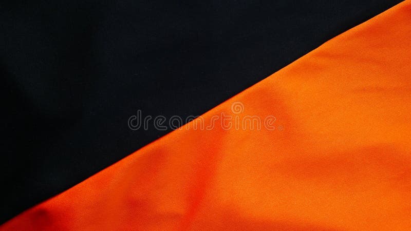 Black and orange silk fabric background,sportswear cloth texture, black bedding. Orange and Black silk fabric background,sportswear cloth texture stock photo Black and orange silk fabric background,sportswear cloth texture, black bedding. Orange and Black silk fabric background,sportswear cloth texture stock photo