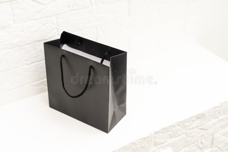 Black Paper Bag with Handles on a White Background Stock Photo - Image