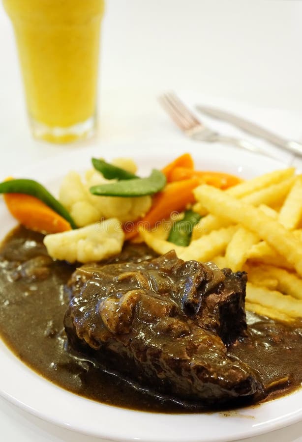 Black Pepper Rib Eye Steak with Orange Juice Stock Photo Image of