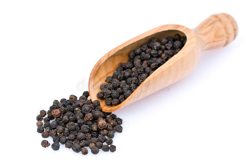 An isolated scoop and black peppercorns.