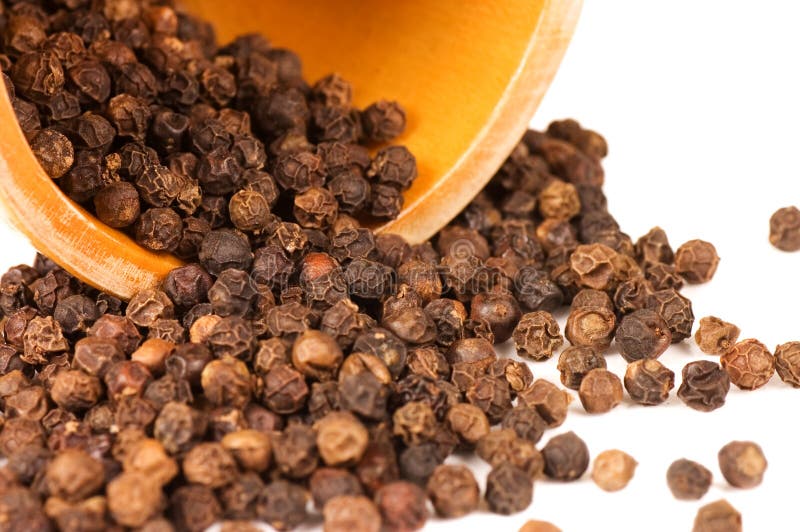 Black Peppercorns in a Pestle and Mortar and Ground Pepper Stock Photo