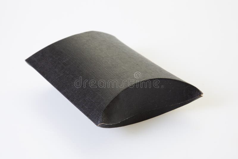 Black Pillow Shaped Gift Box on a White Background Stock Photo Image