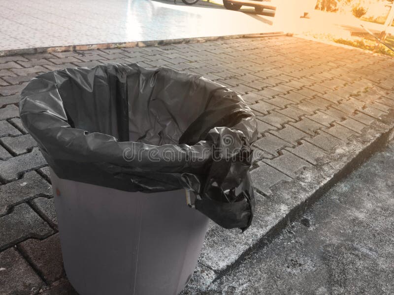 Black Plastic Bag on Trash Bin of Household Waste. Stock Image Image