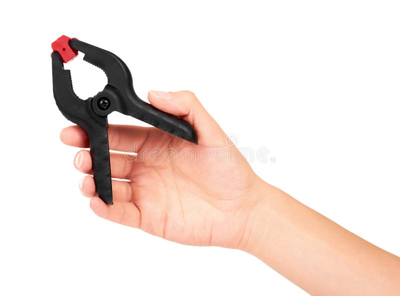 Black plastic clamp in hand isolated on white background