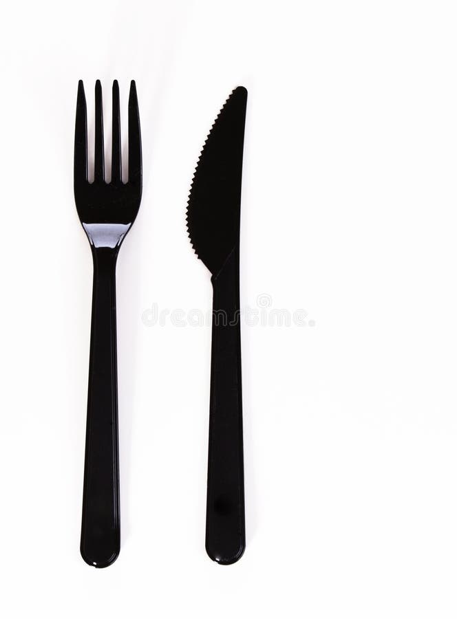 Black plastic fork and knife isolated on white background royalty free stock photography