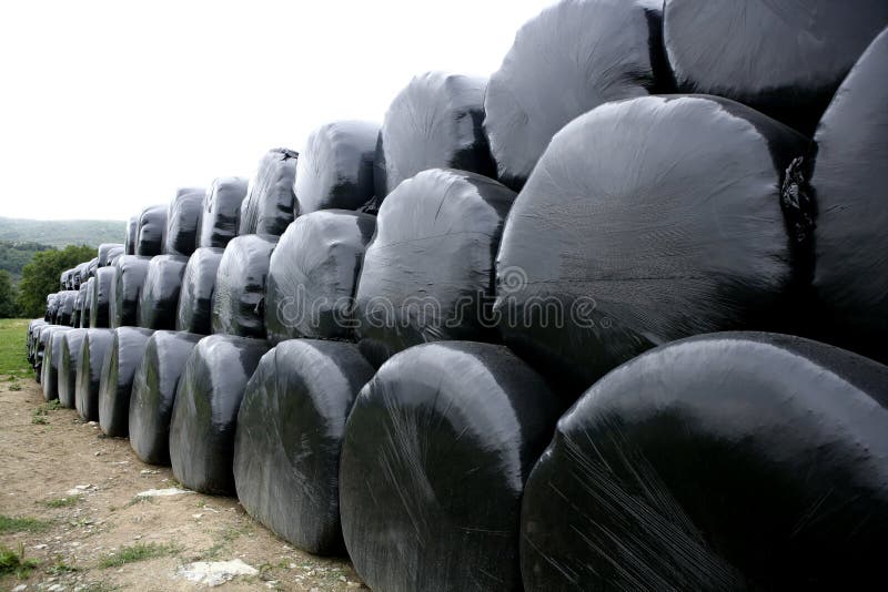 Black plastic wrap cover for cereal bales stock photos