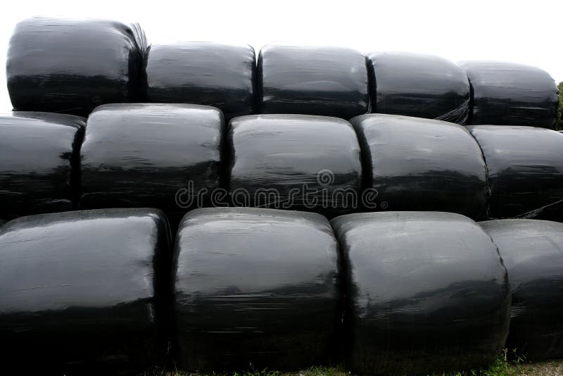 Black plastic wrap cover for cereal bales royalty free stock images