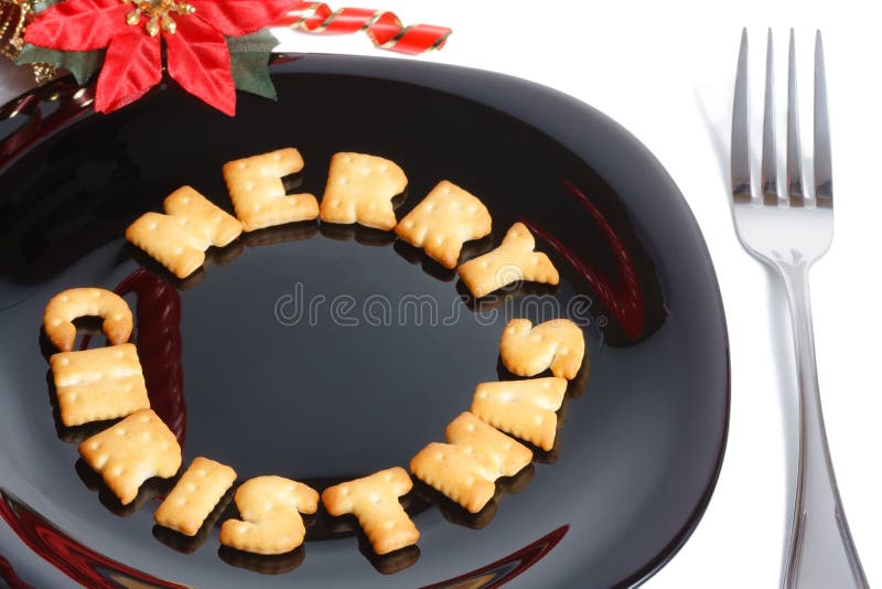 Black plate with cookies, fork and decoration