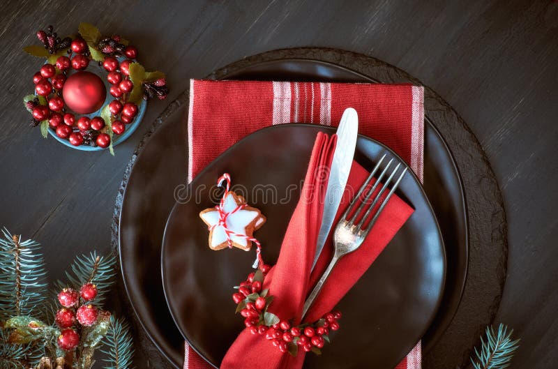 Black Plates and Vintage Cutlery with Christmas Decorations in G Stock ...