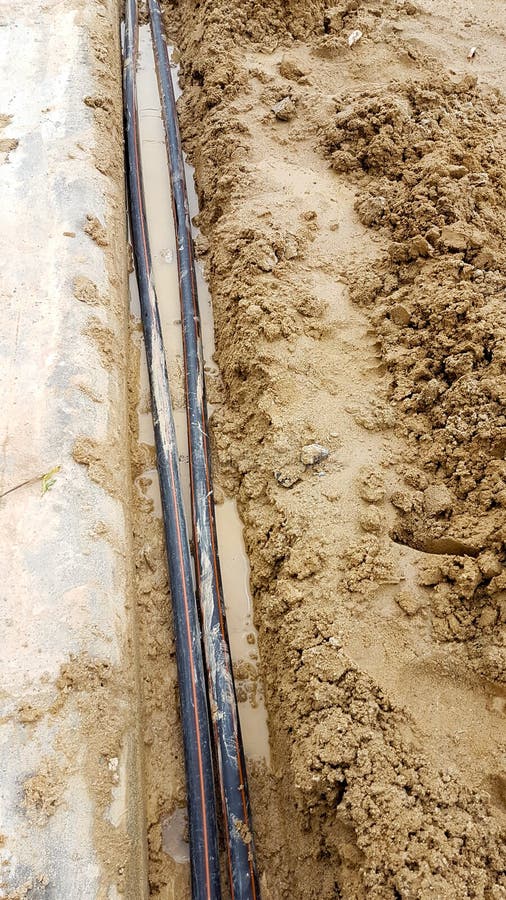 Black Power Cable with Red Strip One the Ground Stock Photo Image of