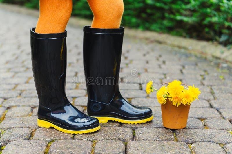 yellow and black rain boots