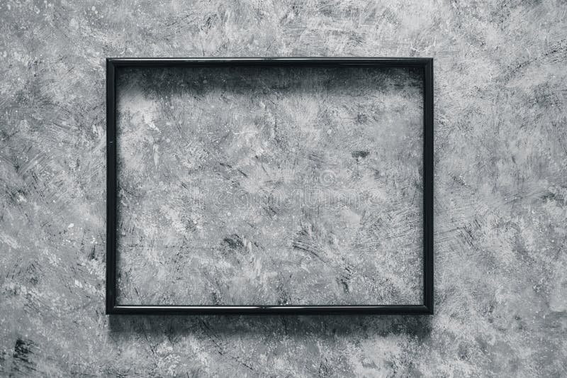 Black rectangular picture frame mock-up with copy space for yout text or image on top of hand painted grey background royalty free stock images Black rectangular picture frame mock-up with copy space for yout text or image on top of hand painted grey background royalty free stock images