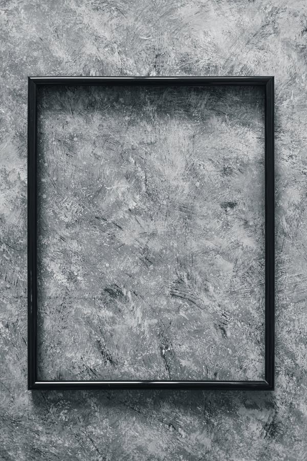 Black rectangular picture frame mock-up with copy space for yout text or image on top of hand painted grey background royalty free stock photography Black rectangular picture frame mock-up with copy space for yout text or image on top of hand painted grey background royalty free stock photography