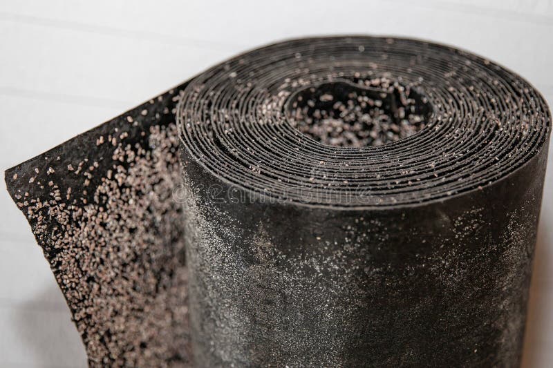 Black rolled waterproofing roofing material with detailed textured surface used in building insulation and renovation projects stock photography