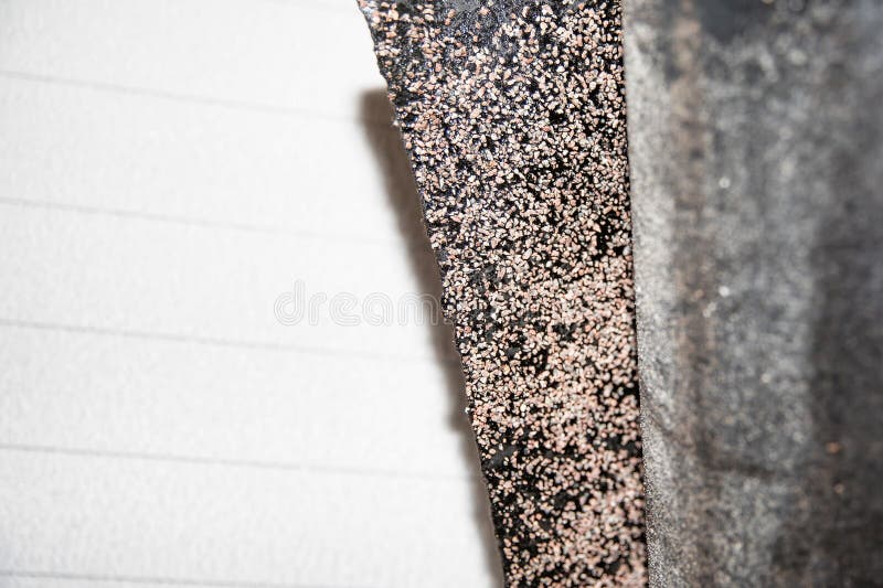 Black rolled waterproofing roofing material with detailed textured surface used in building insulation and renovation projects royalty free stock photo