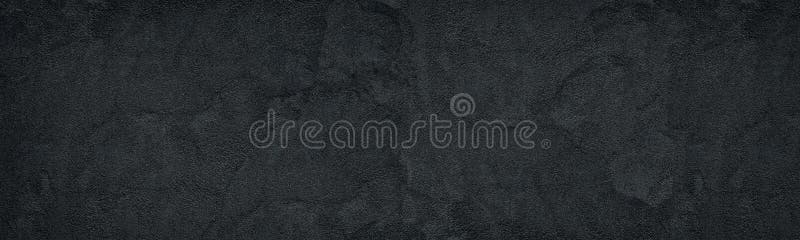 Black rough concrete wall wide texture. Fine textured cement plaster. Dark grey grunge widescreen background