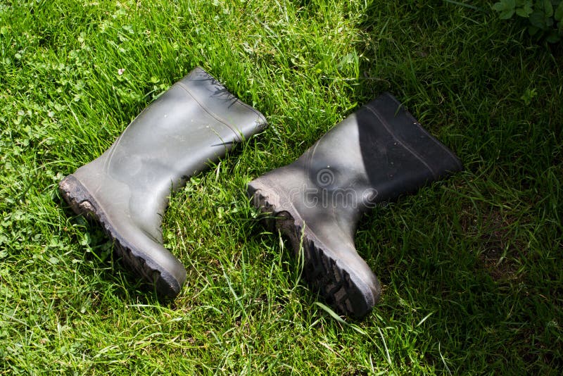 Black Rubber Boots on Green Grass Stock Photo Image of iron, drill