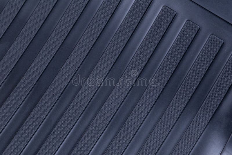 Black rubber car mats isolated on a white background. Black rubber car mats isolated on a white background