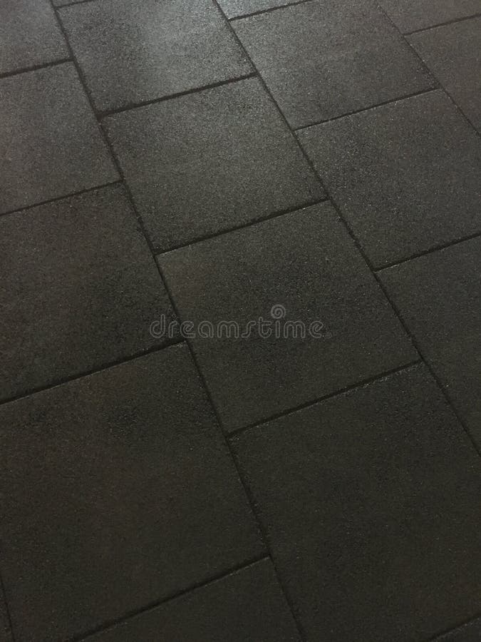 Black Rubber Mat Flooring In Fitness Center Or Playground Stock