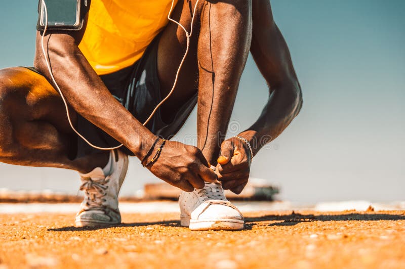 Black Runner Tie His Shoes at the Beach Stock Image Image of leisure