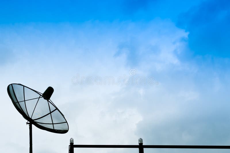 Black satellite dish or TV antennas on the building with the blue sky cloudy stock images Black satellite dish or TV antennas on the building with the blue sky cloudy stock images