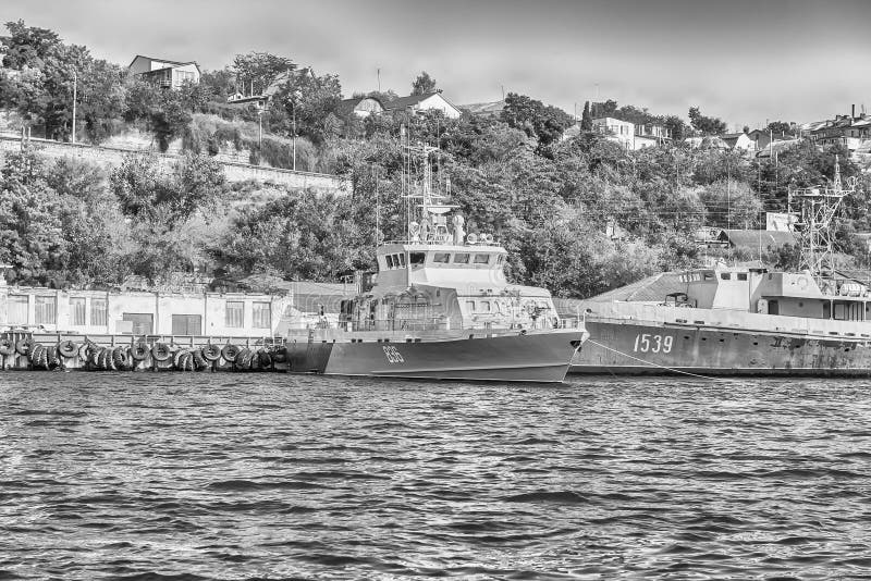 a fleet of warships; a large force or group usually of moving things a fleet of warships; a large force or group usually of moving things