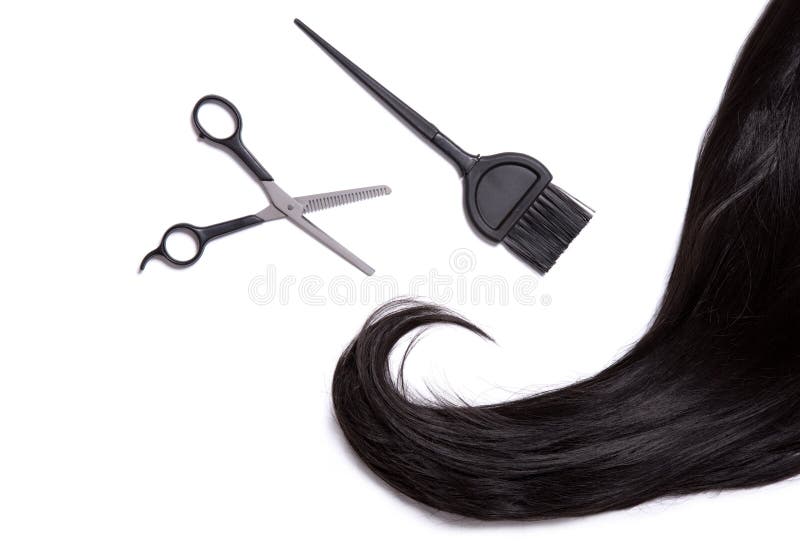 Black shiny hair with professional scissors and hair dye brush royalty free stock photography Black shiny hair with professional scissors and hair dye brush royalty free stock photography