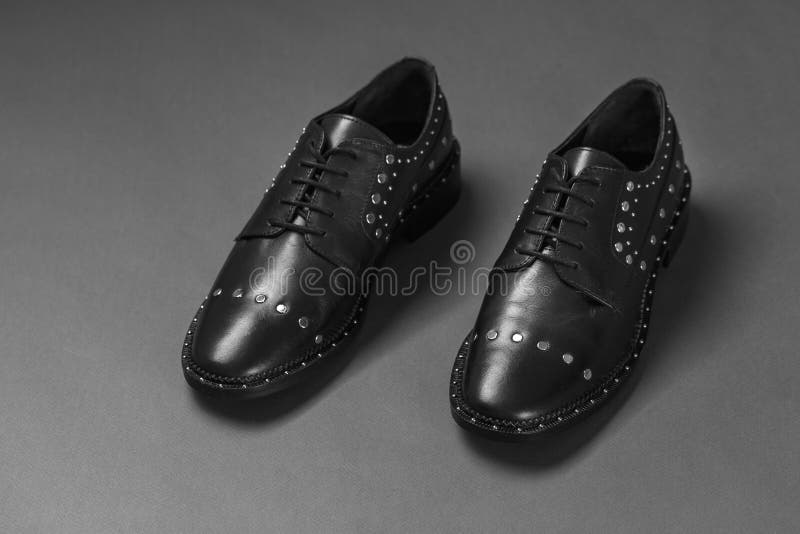 Black shoes with rivets stock image. Image of couture - 142848595