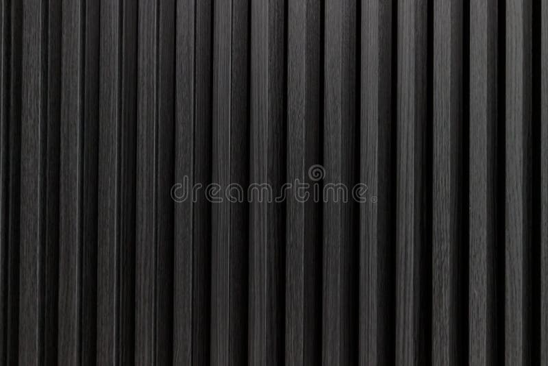 black solid wooden battens wall pattern background stock image