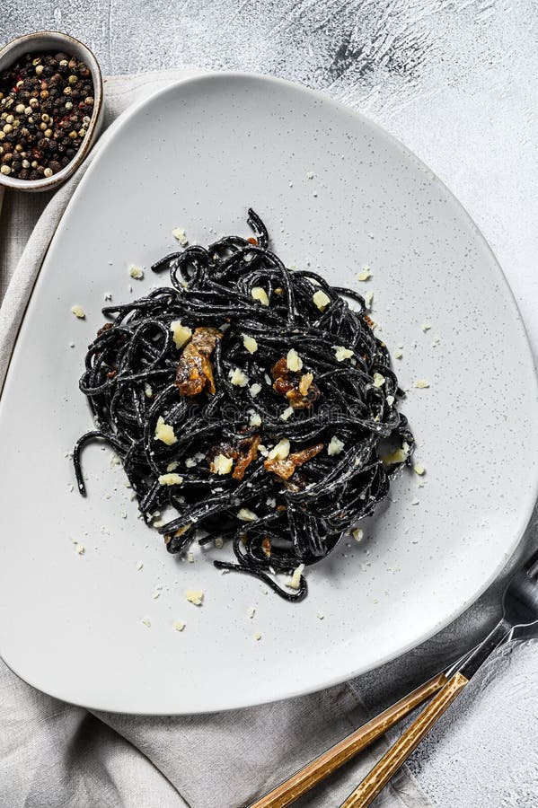 Black Spaghetti Pasta with Squid Ink in a Pan. Beef in Pepper Sauce