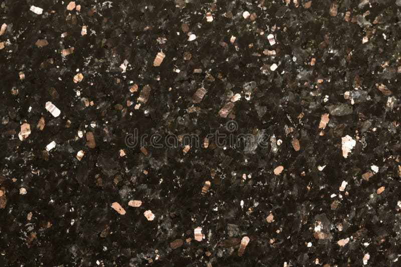 Closeup of black sparkle polished granite abstract background