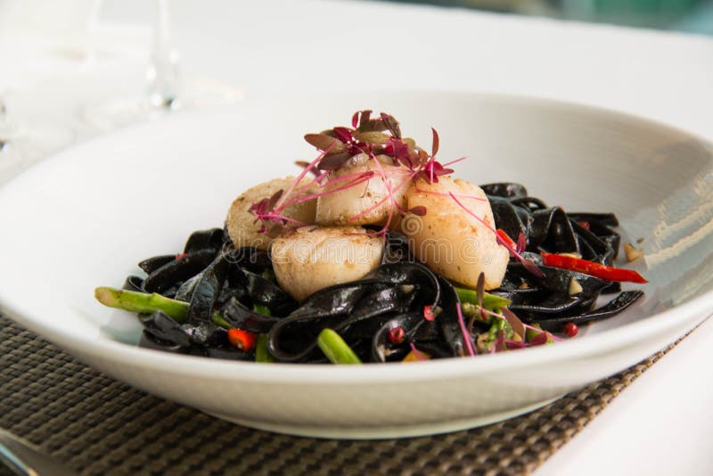 Black Squid Ink Pasta is Paired with Scallops Stock Image Image of