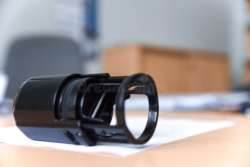 Black stamp is on the document in the office