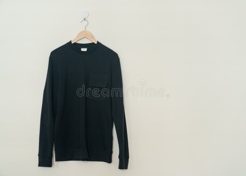 Black Sweater Hanging on Hanger Stock Image - Image of fabric, brown ...