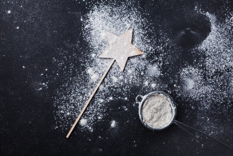 Black table with flour for christmas baking. Top view. royalty free stock photography Black table with flour for christmas baking. Top view. royalty free stock photography