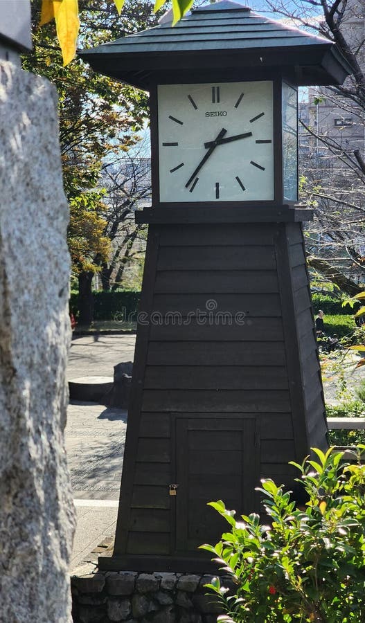 Black tall clock with vintage style in outdoor garder royalty free stock photos