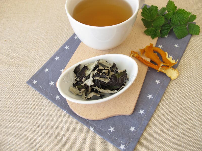 Black Tea from Fermented Blackberry Leaves and Orange Peel Stock Photo