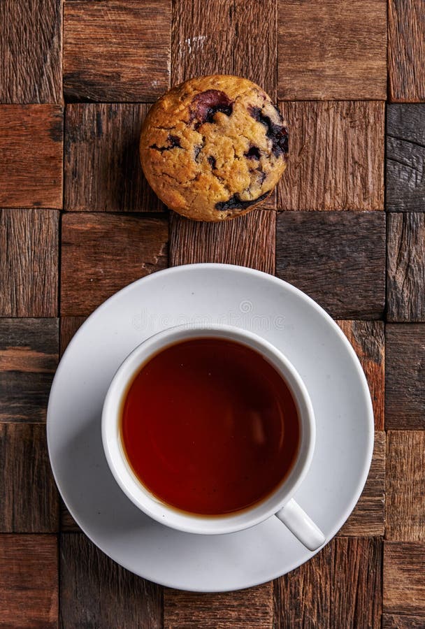 Black tea and muffin stock image. Image of bakery, black 111519441
